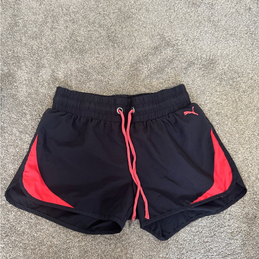 Puma girls  Black Shorts with coral  Highlights.  Size medium.